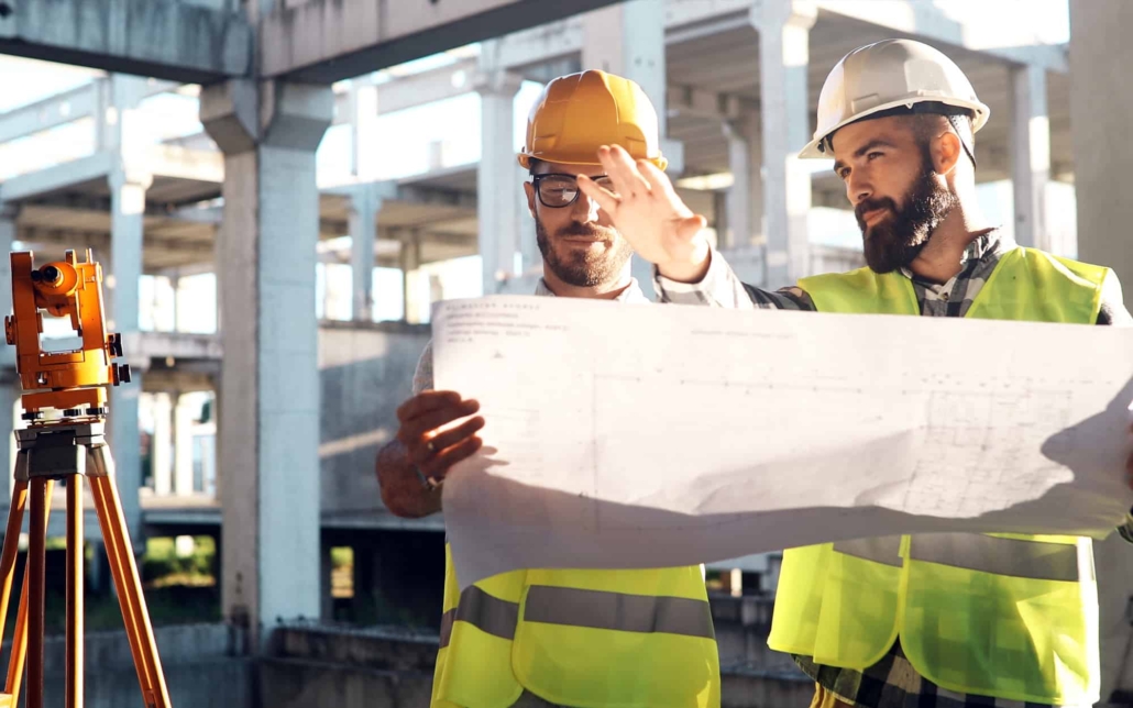 Portrait-of-construction-engineers-working-on-building-site